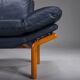 Danish teak and navy blue leather lounge chair from Komfort, 1970s