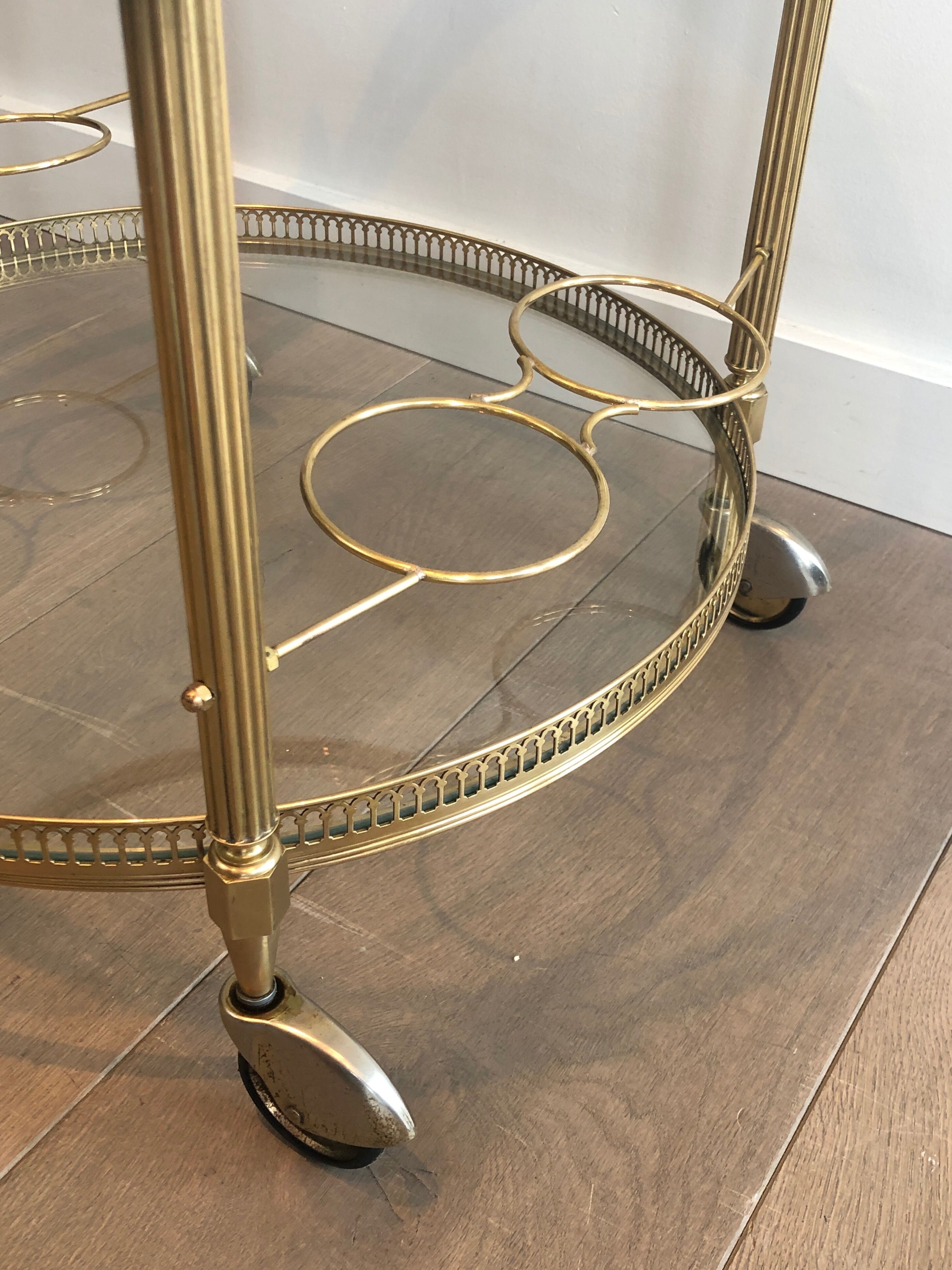 Neoclassical style rolling table in brass