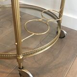 Neoclassical style rolling table in brass
