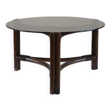 Table basse ronde en rotin et verre fumé — années 70