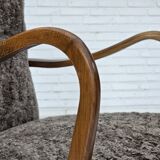 1960s, reupholstered Danish armchair, with stool, genuine sheepskin.