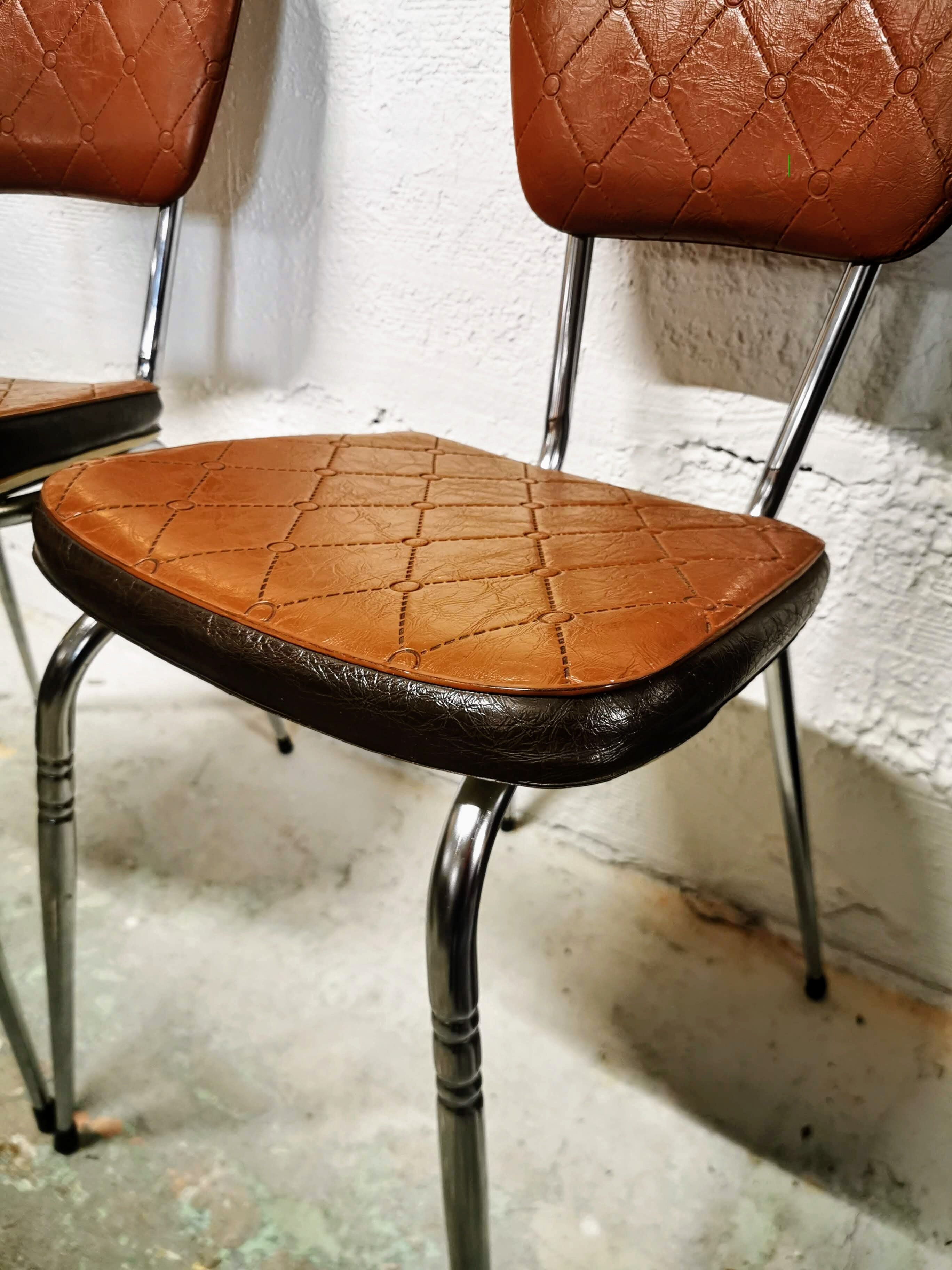 Pair of chrome and skai chairs