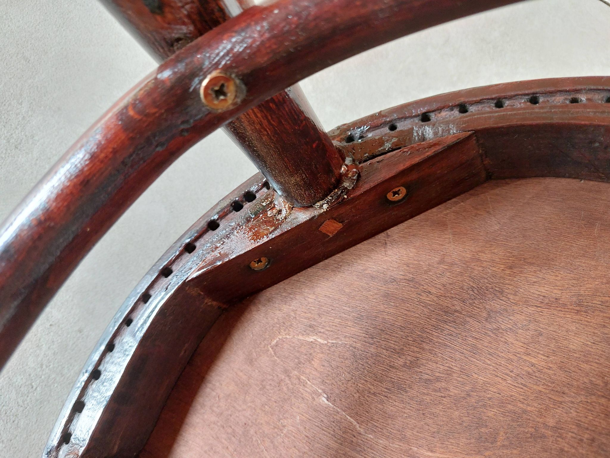 pair of round bistro chairs with a pattern on the seat, vintage