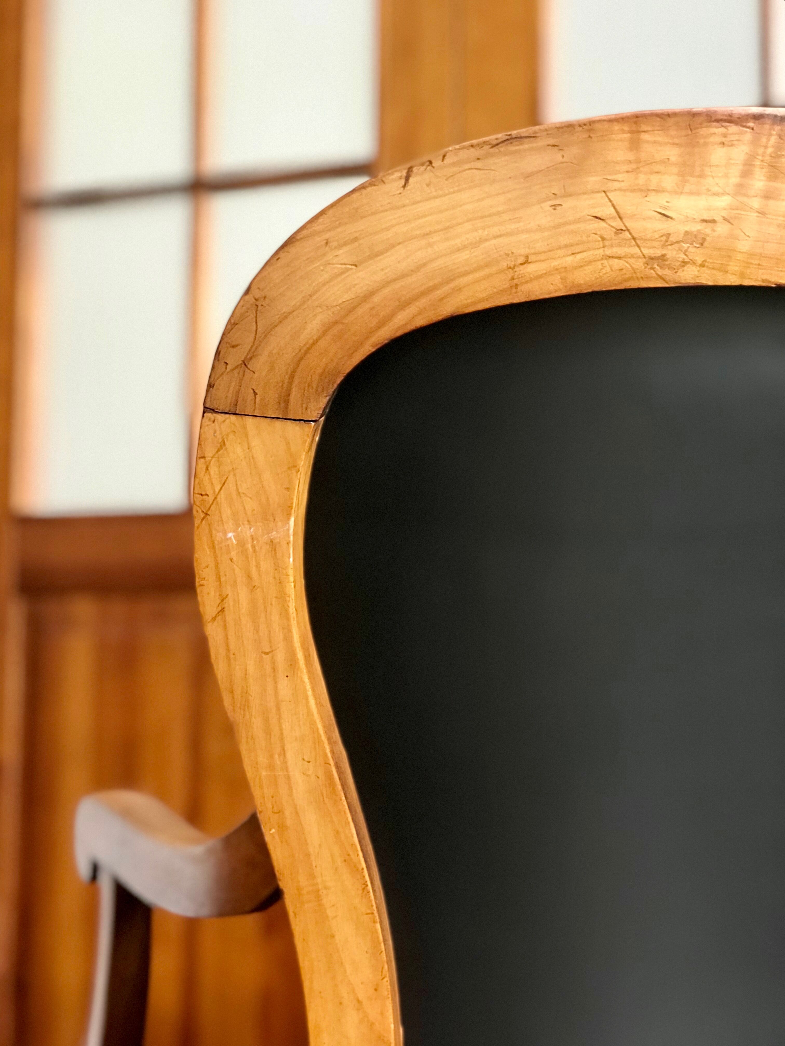 Wood and leather armchair