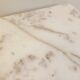 Pair of vintage nesting coffee tables in white marble from the 1970s.