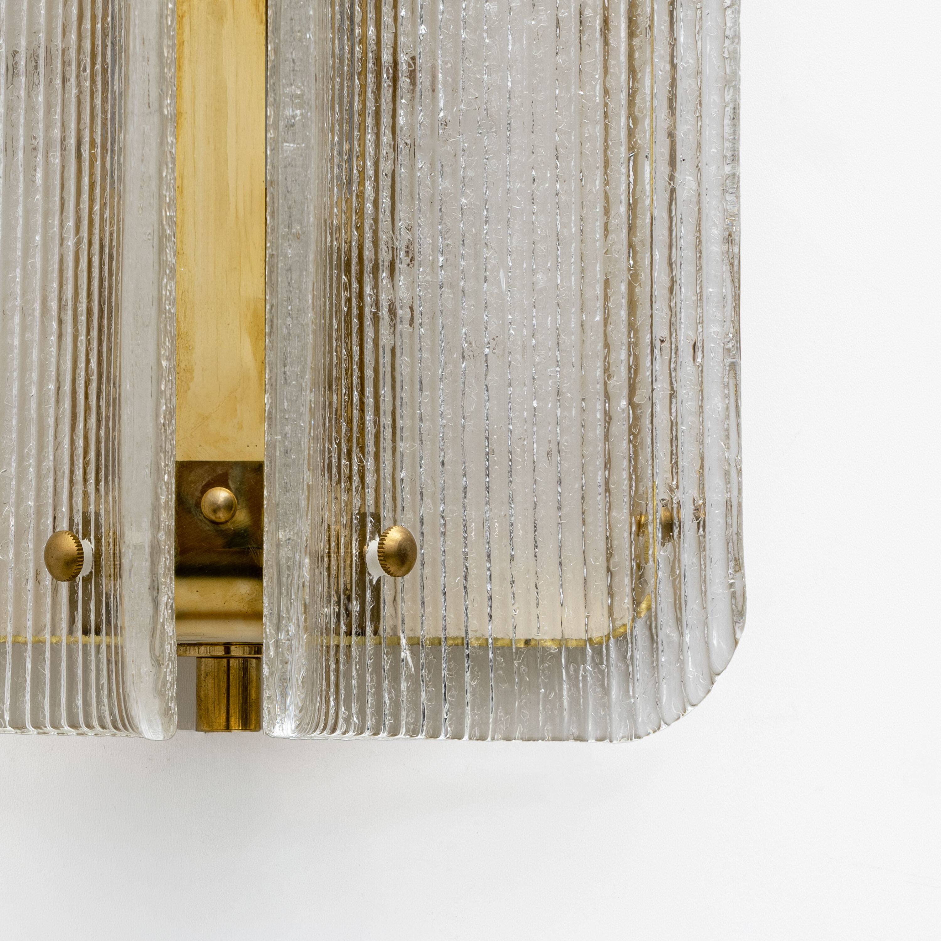 Pair of Curved Clear Ribbed Murano Glass and Brass Wall Sconces