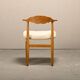Henning Kjærnulf dining chairs set in Oak and Sheepskin, Denmark, 1960s