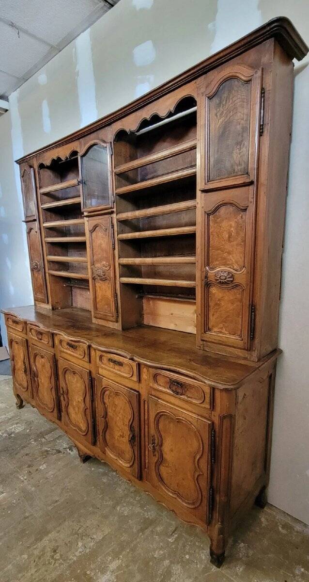 Clock cabinet from the Louis XV period in walnut and elm, fully carved.