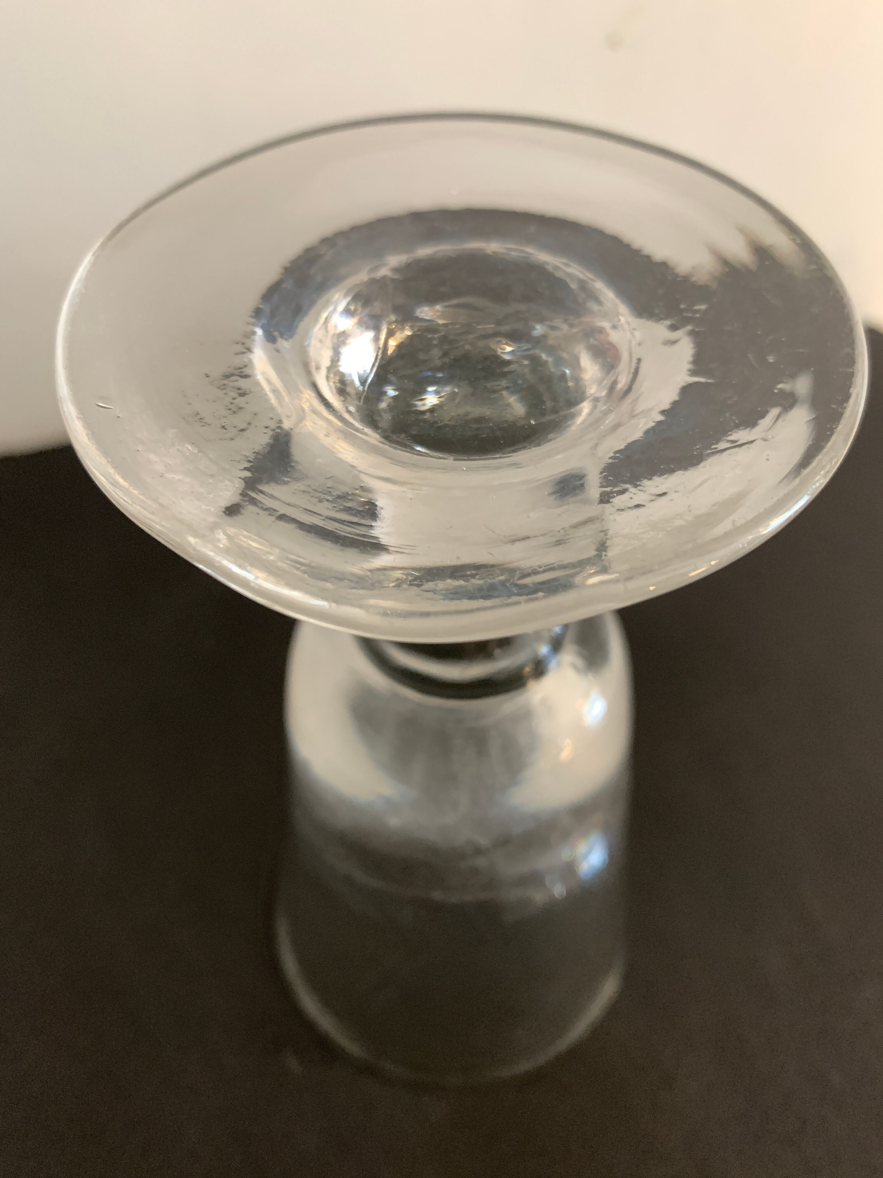 12 old glasses on foot at bistro or absinthe