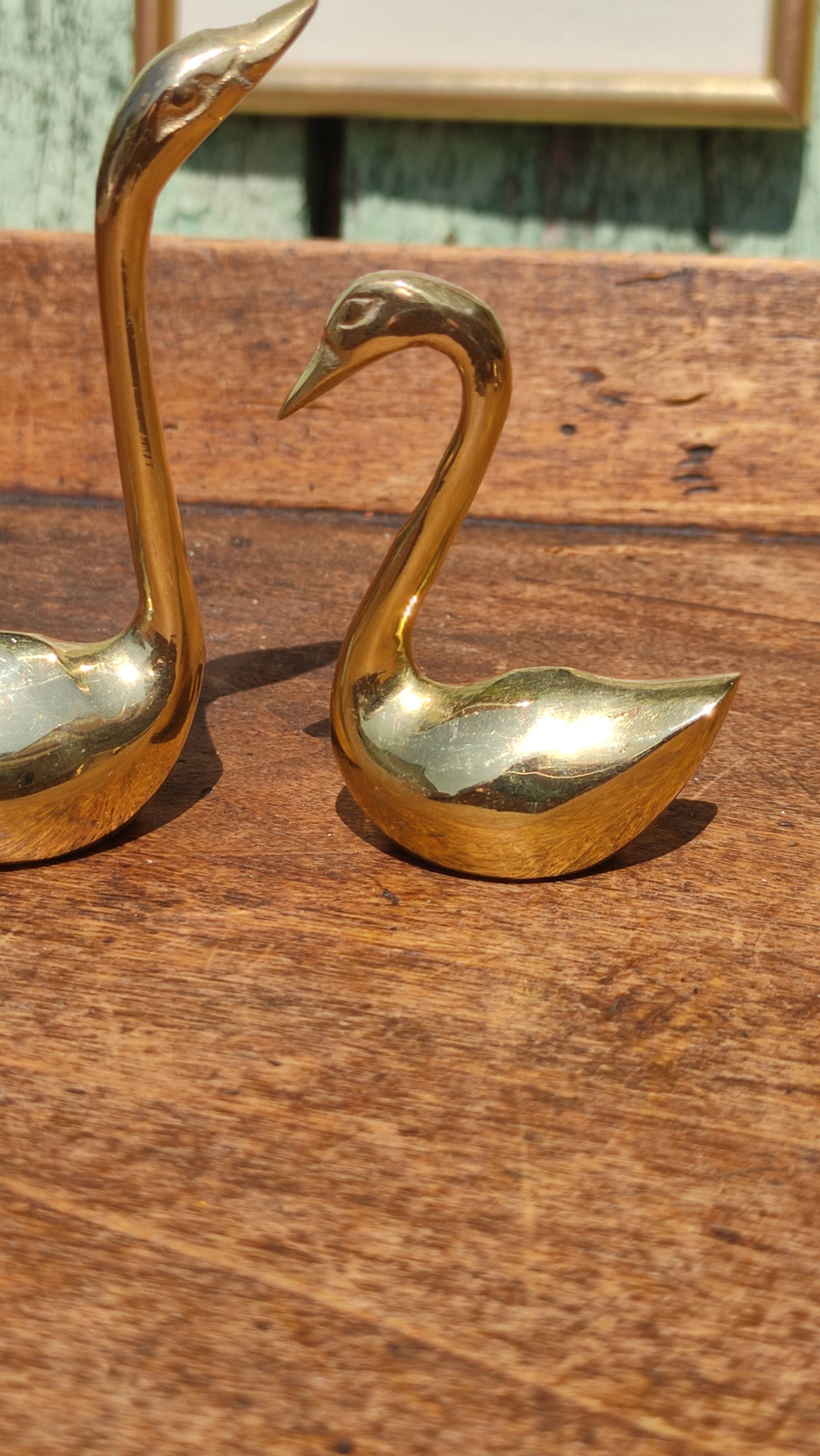 Pair of golden brass swans
