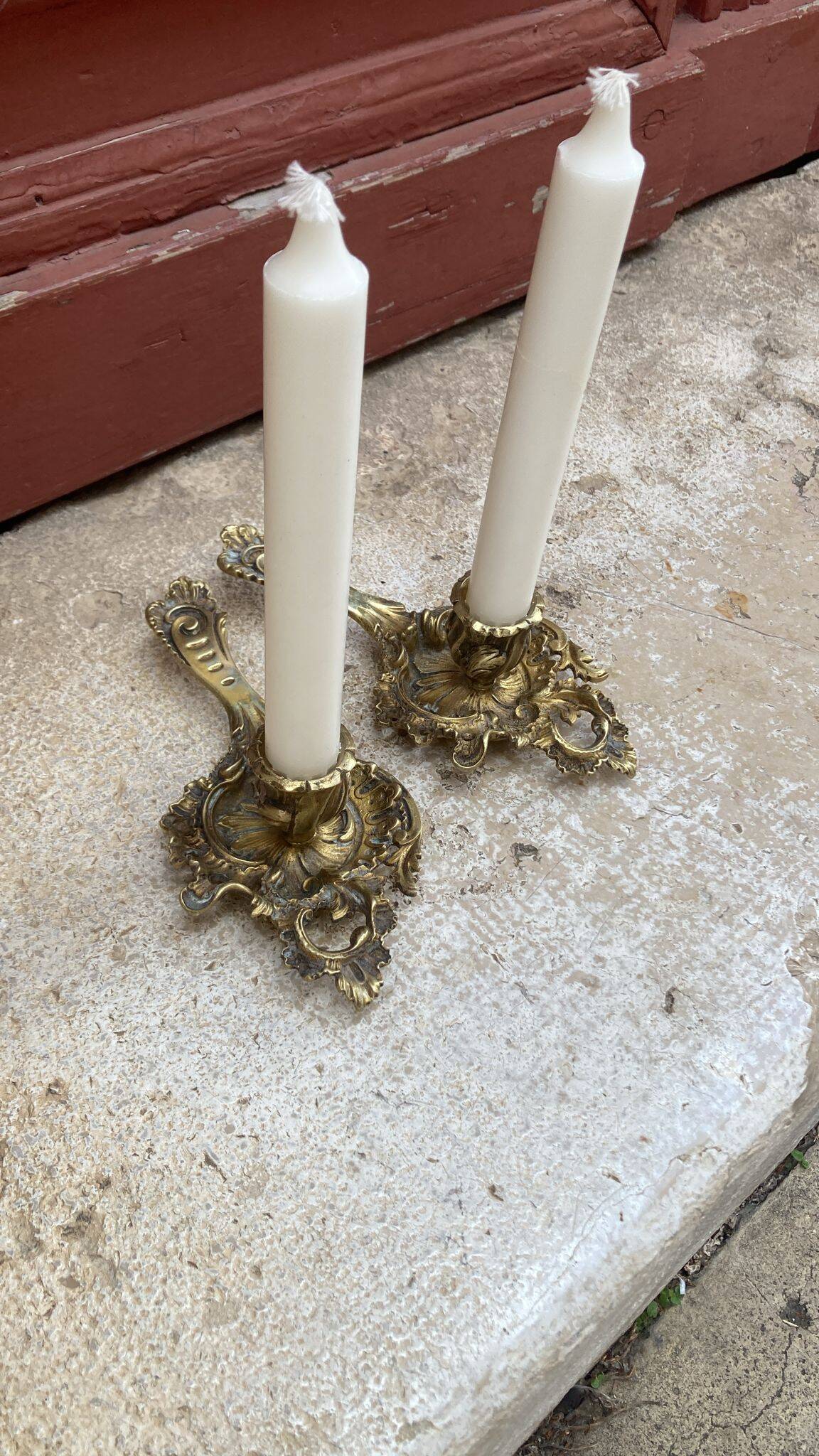 Pair of hand candlesticks / bronze candle holders