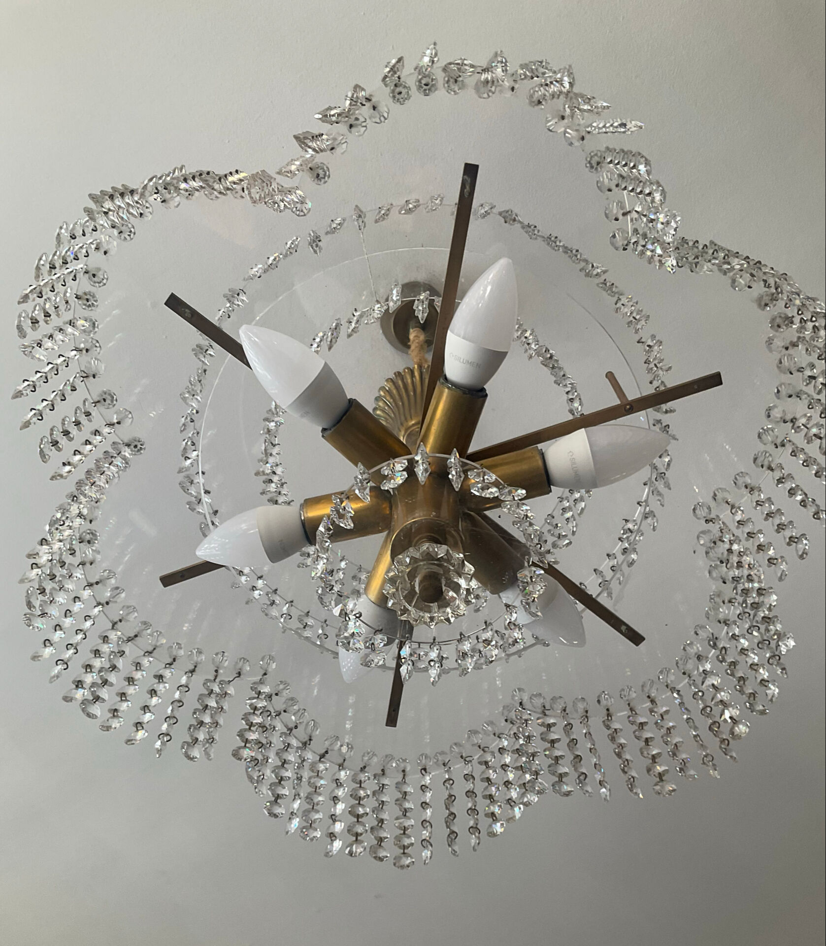 Vintage lucite chandelier with a cascade of crystal pendants from the 1970s.