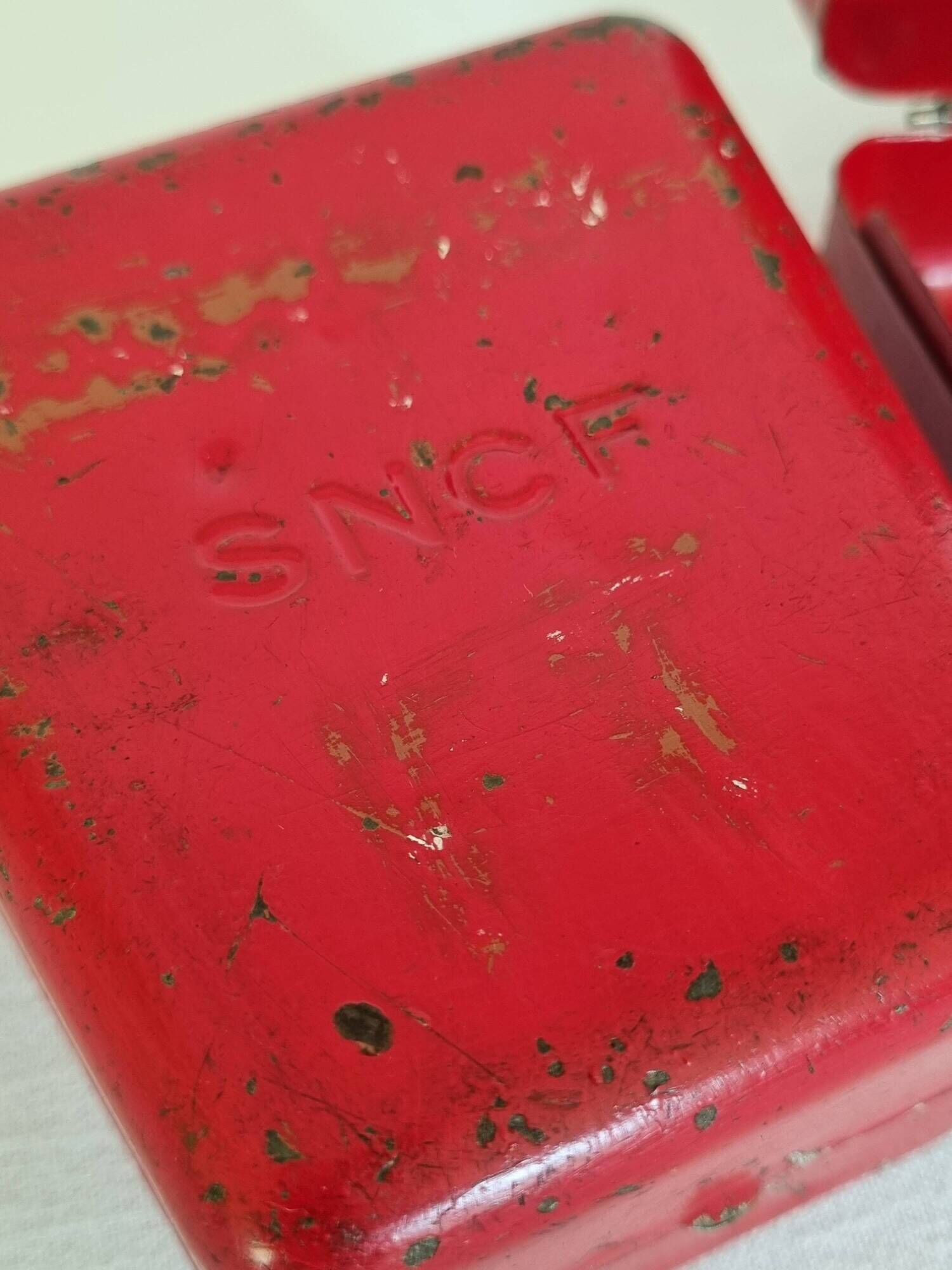 Set of three red painted metal railway boxes with SNCF logo