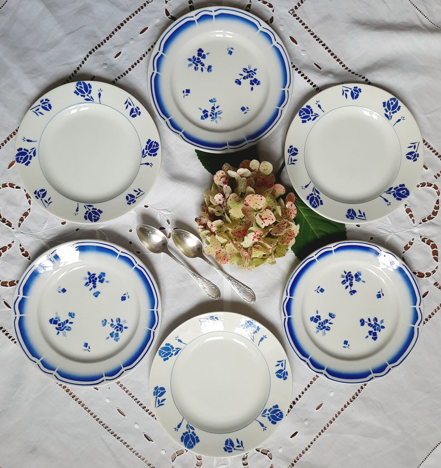 Mismatched old dessert plates accompanied by a dish