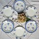 Mismatched old dessert plates accompanied by a dish