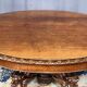 Large extendable dining table in hunting style with four fox figures on the leg.