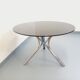 Vintage dining table in smoked glass plexiglass and chrome metal.