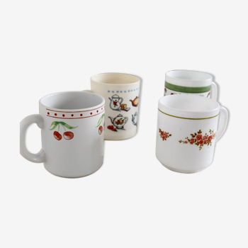 Mismatched white cups/mug with floral pattern or breakfast