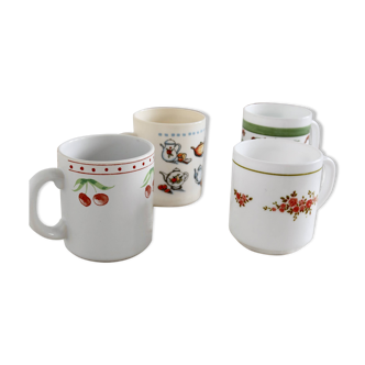 Mismatched white cups/mug with floral pattern or breakfast