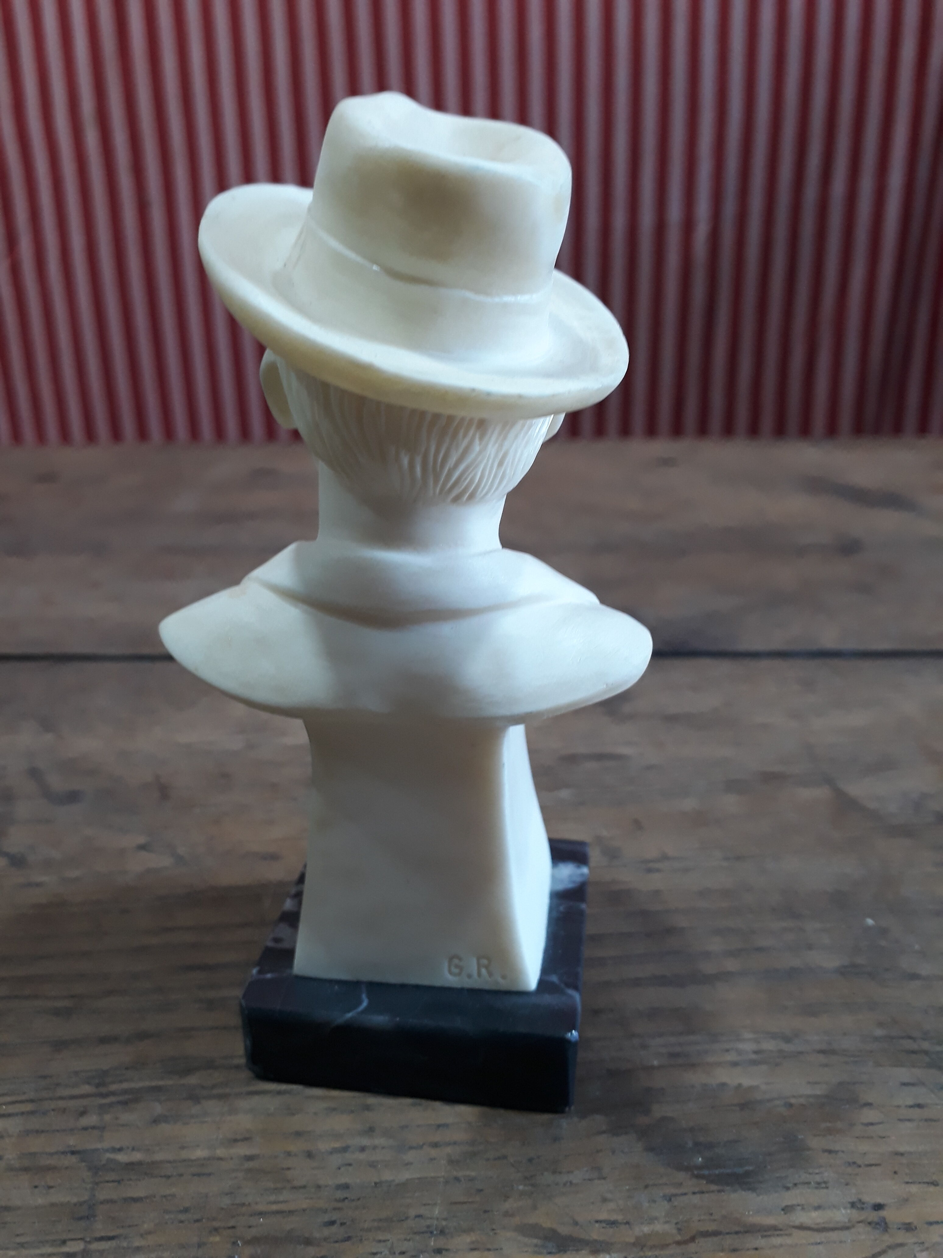 Resin bust by Puccini, marble base