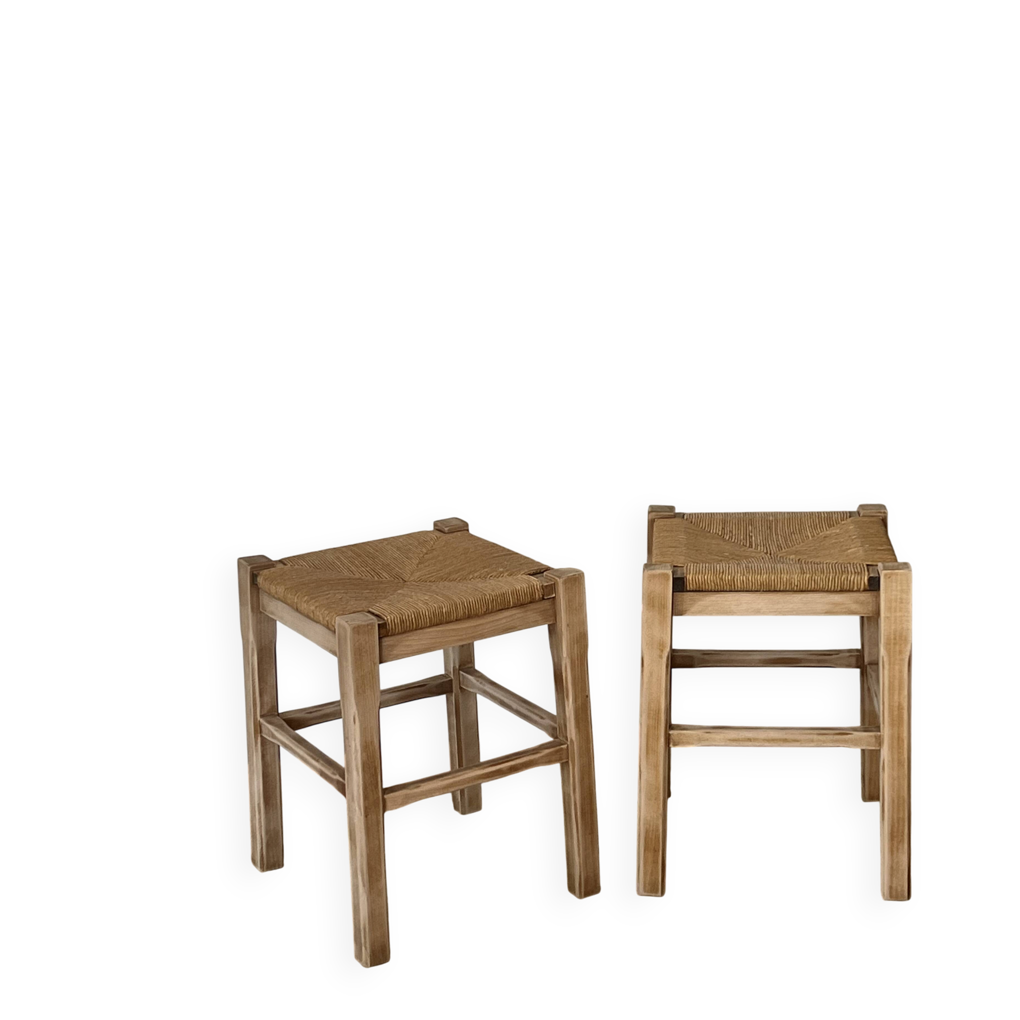 Pair of antique stools in raw solid wood with straw seats.