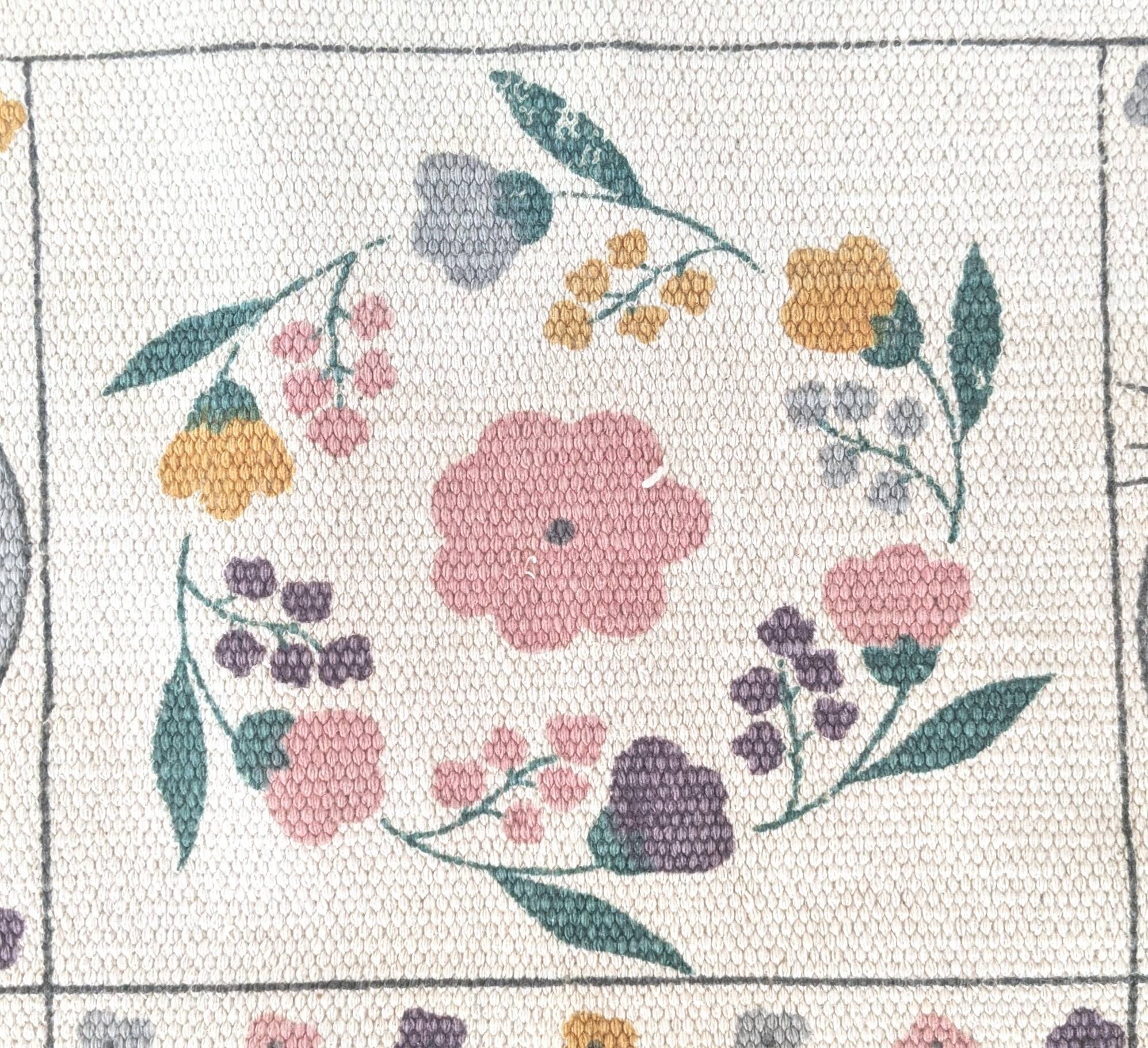 1980s handwoven cotton rug with a cat and flower pattern