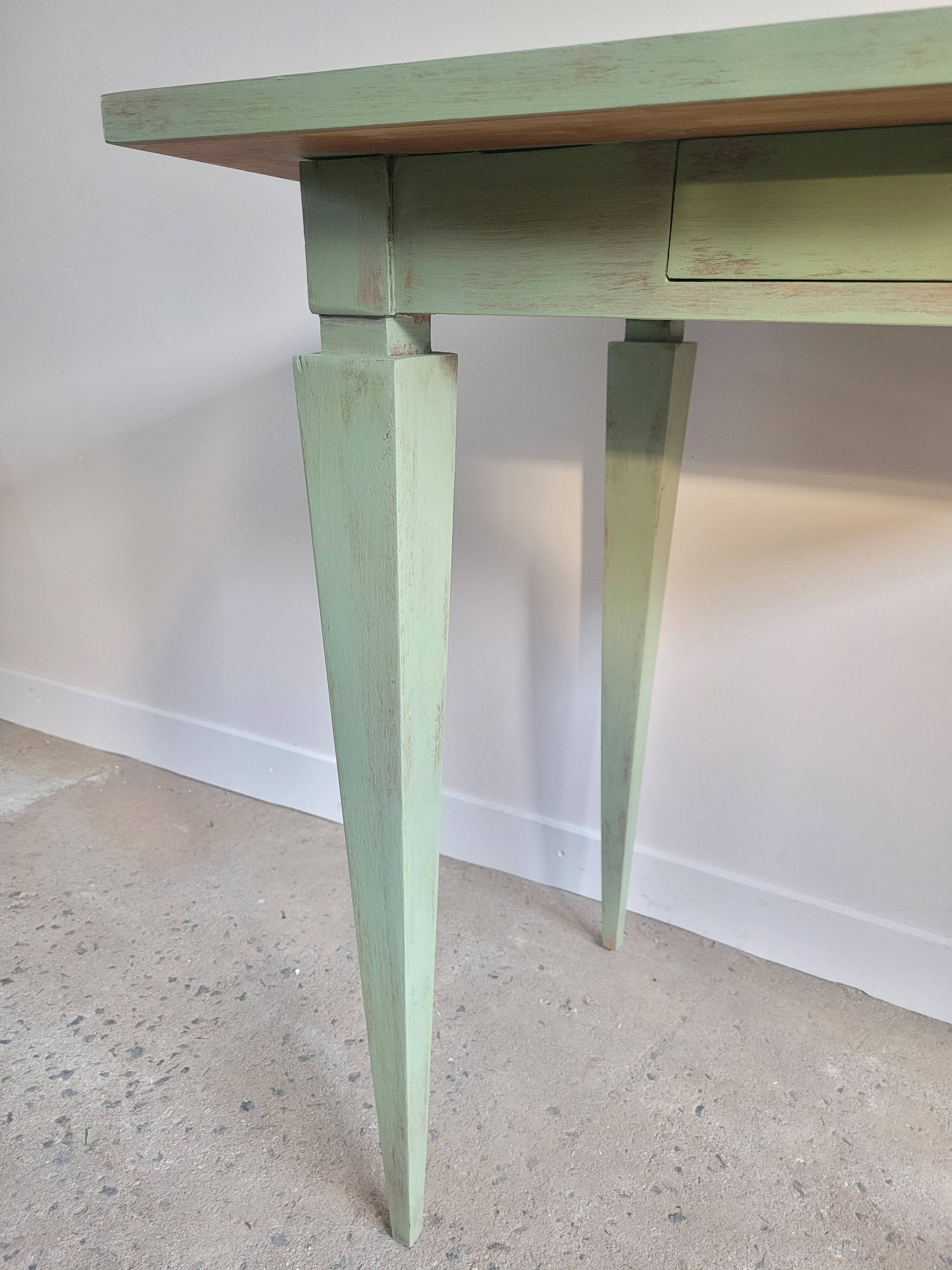 Green side table with tapered legs