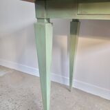 Green side table with tapered legs