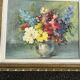 Still life of flowers in Impressionist style with a golden frame.