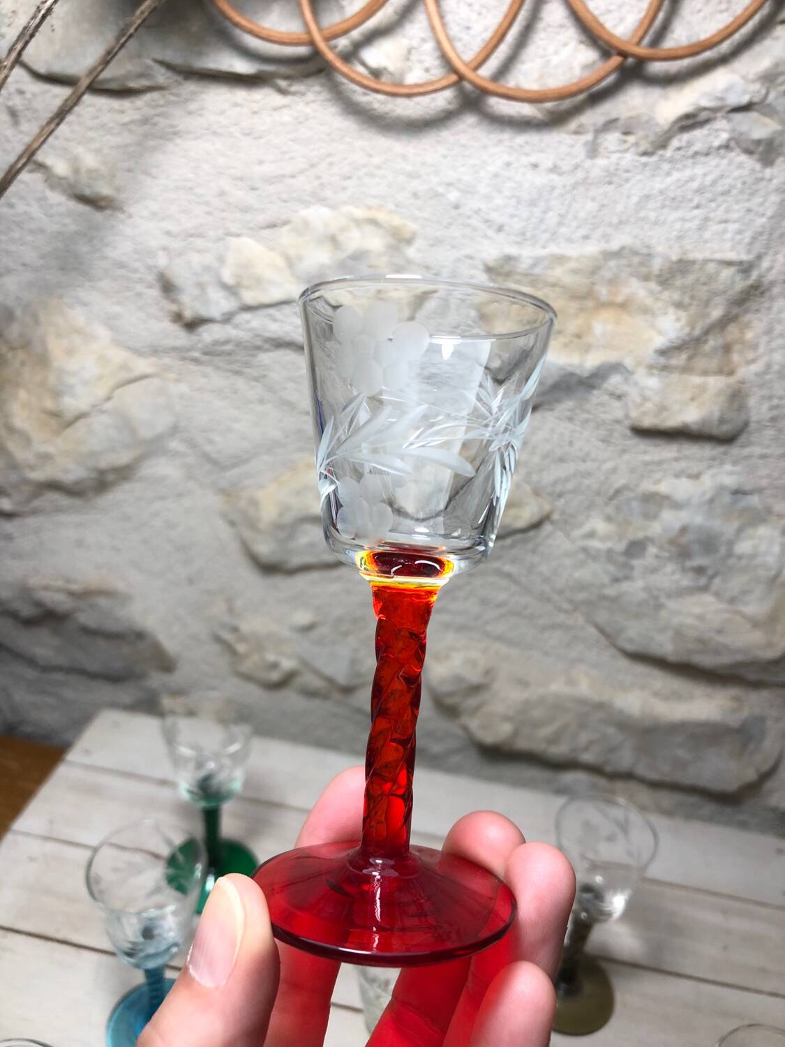 Antique and rare! Sold in a set of 12 colorful twisted stemmed glasses engraved with flowers and leaves