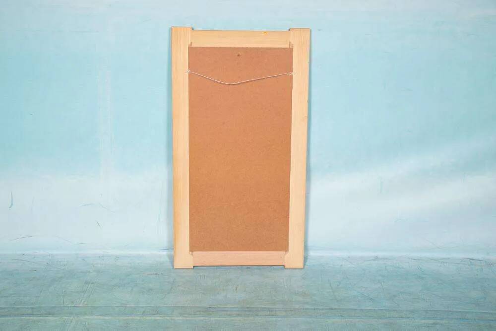 Vintage Danish wall mirror design from the 1960s in oak and stamped brass.