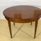 Louis XVl style round table in cherry with extensions
