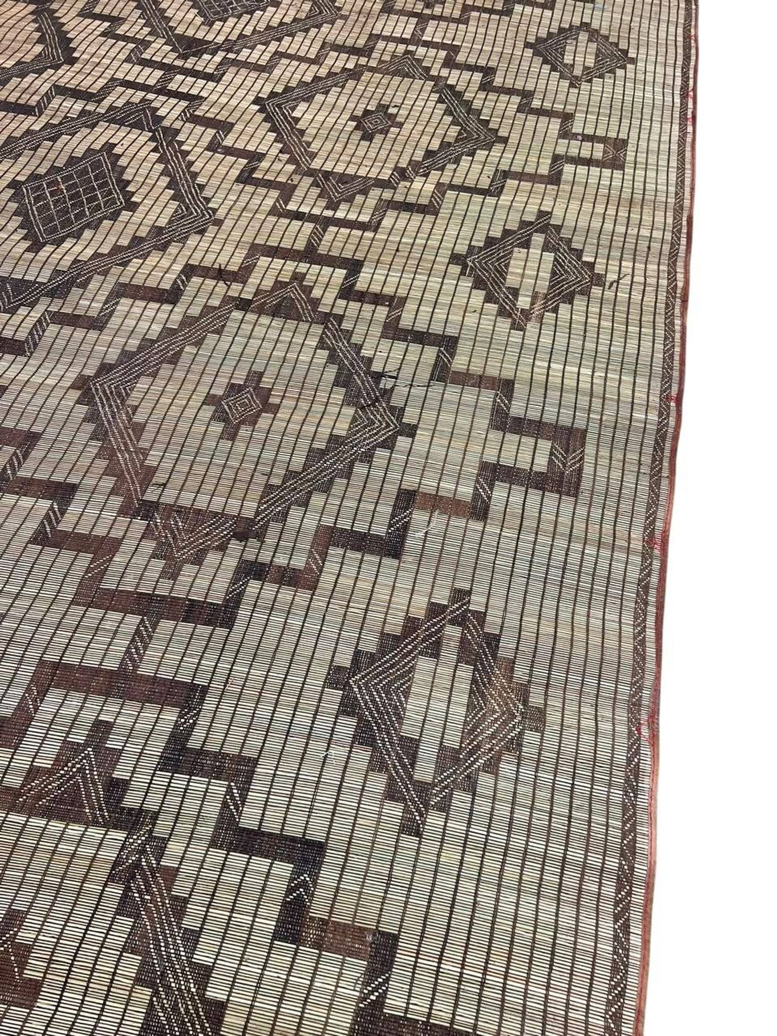 Vintage Touareg mat made of leather and reeds.