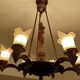 Large Art Deco sculptural chandelier in bronze and glass, 1930s