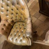 Office chair known as a presidential chair in mahogany and cognac leather.