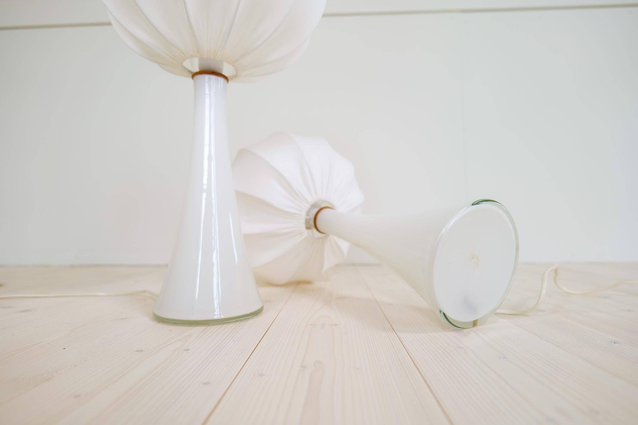 Pair of mid-century opaline glass table lamps with cotton shades by Bergboms, Sweden, 1960.