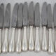 Ercuis Perles 24 knives, 12 table knives + 12 cheese knives in silver-plated metal, nearly new.