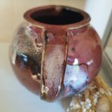Stoneware pitcher by Matthieu Liévois in shades of red