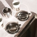 Silver-plated metal coffee service with a grape design.
