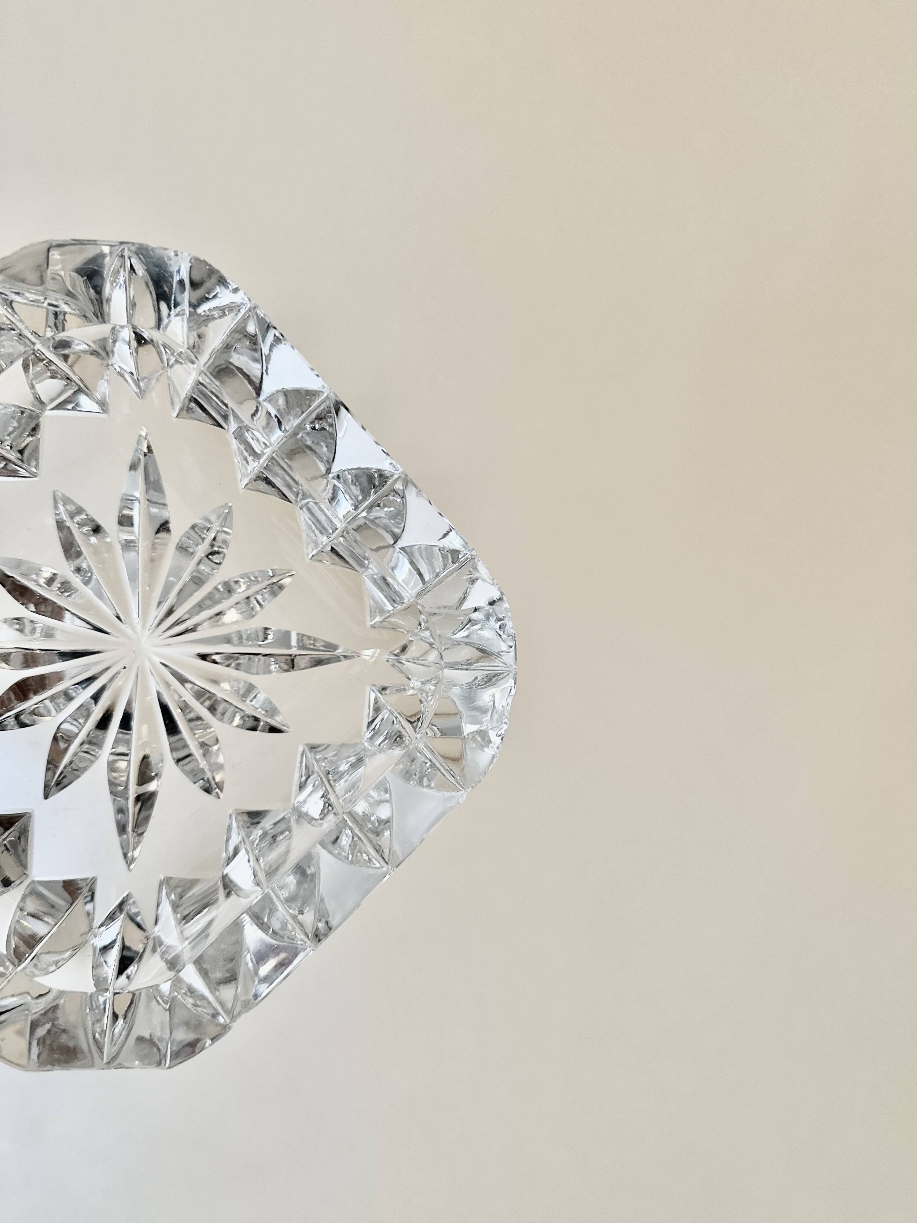 A pair of crystal ashtrays.