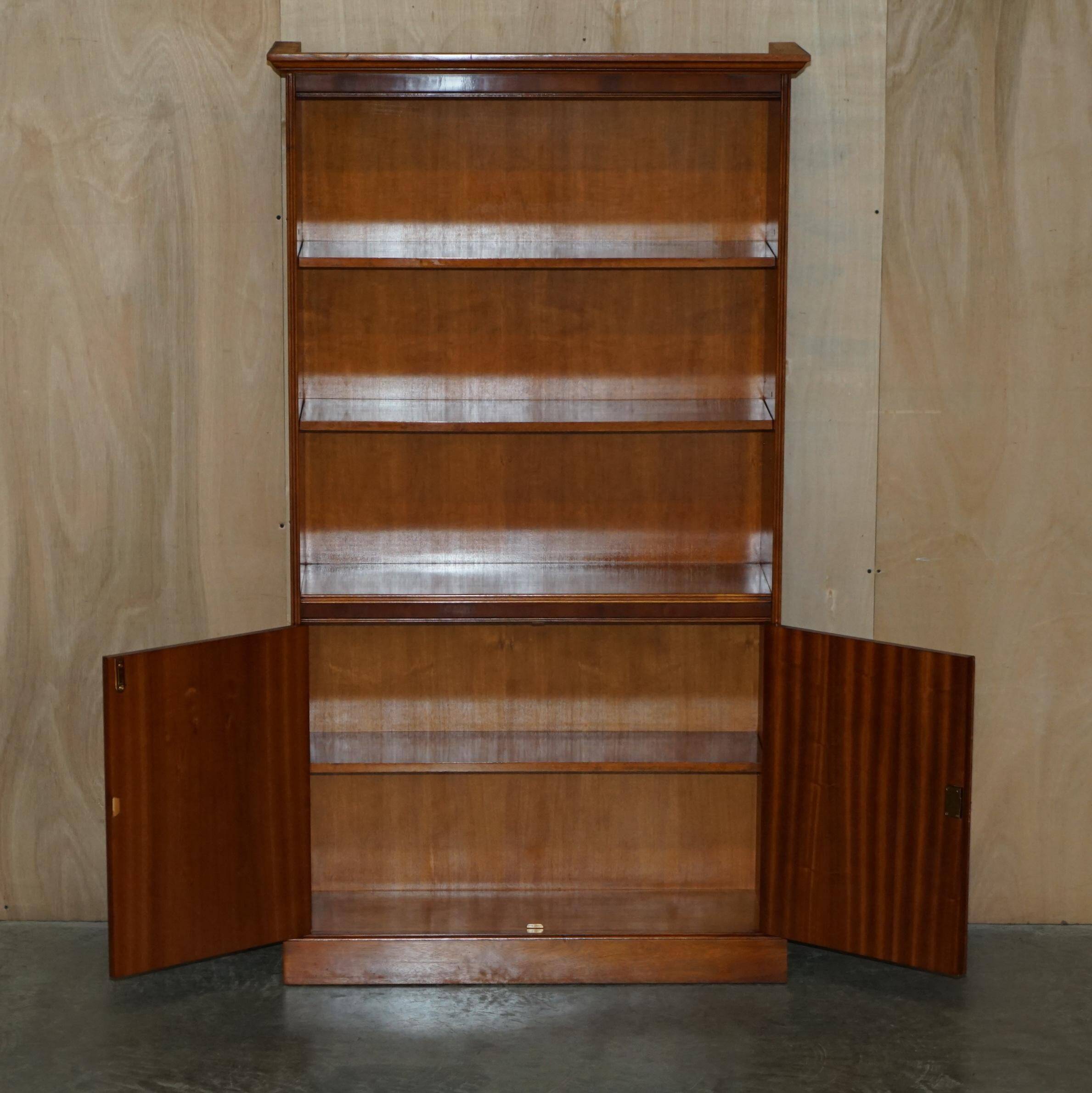 Open library Bradley Furniture made of yew wood with a cupboard base.