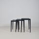 Set of nesting tables in black stained wood and glass top, 1960s