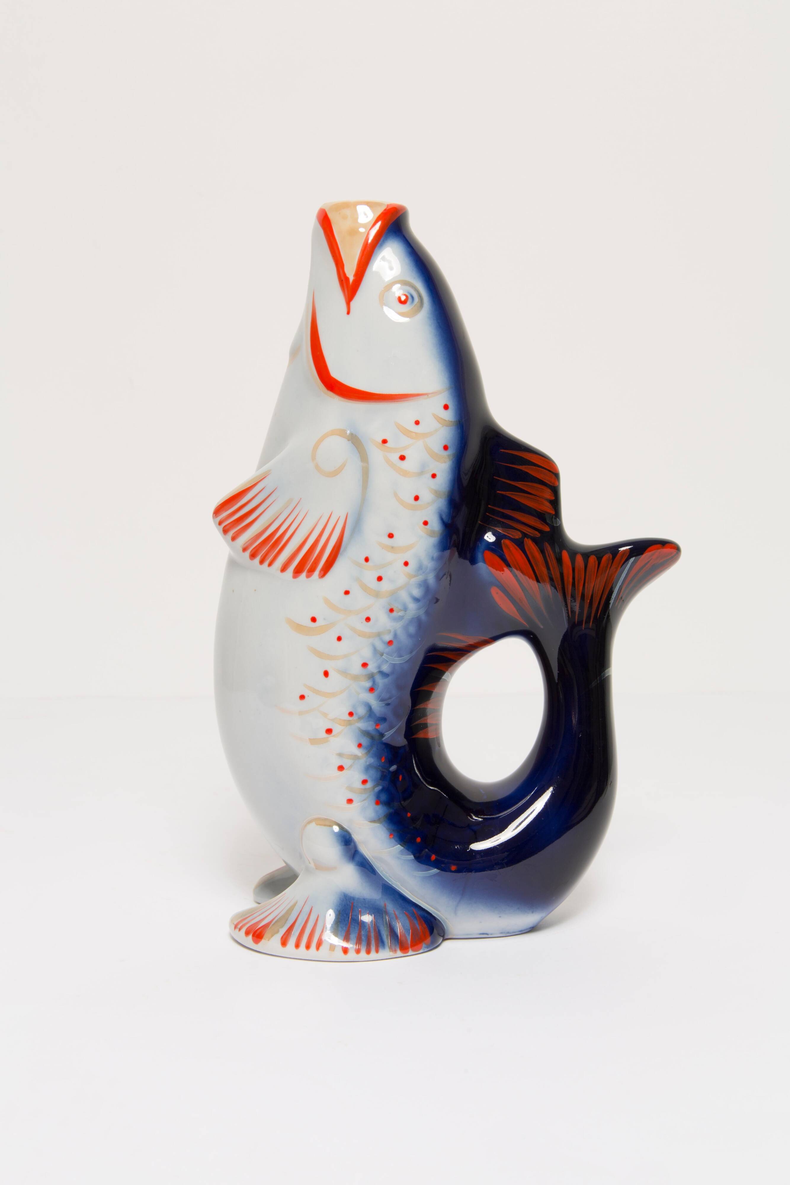 Set of 7 blue glass fish, mid-20th century.