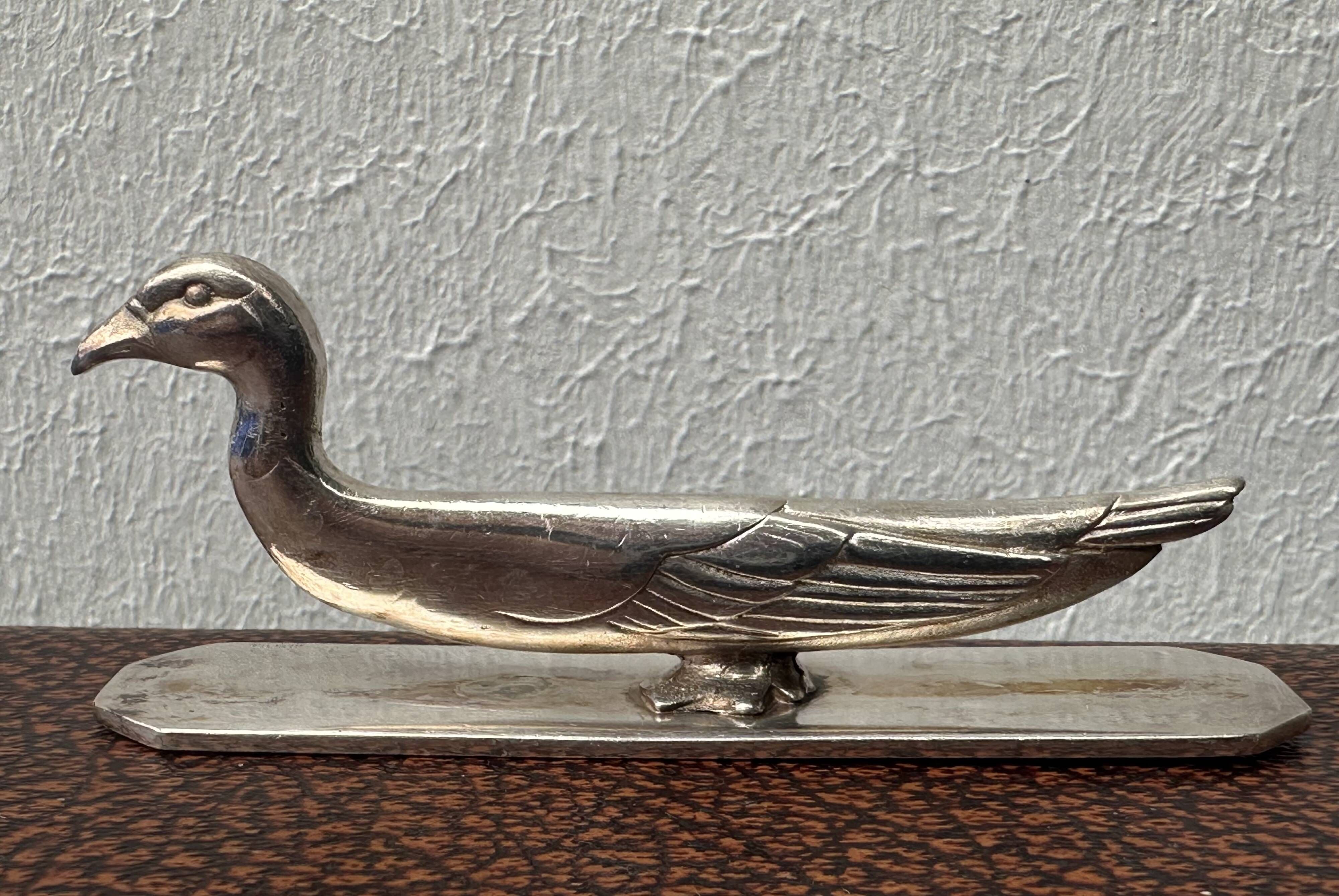 12 antique silver-plated bronze knife rests in modern art deco animal designs.