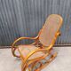 Rocking chair made of bent wood and rattan wicker.