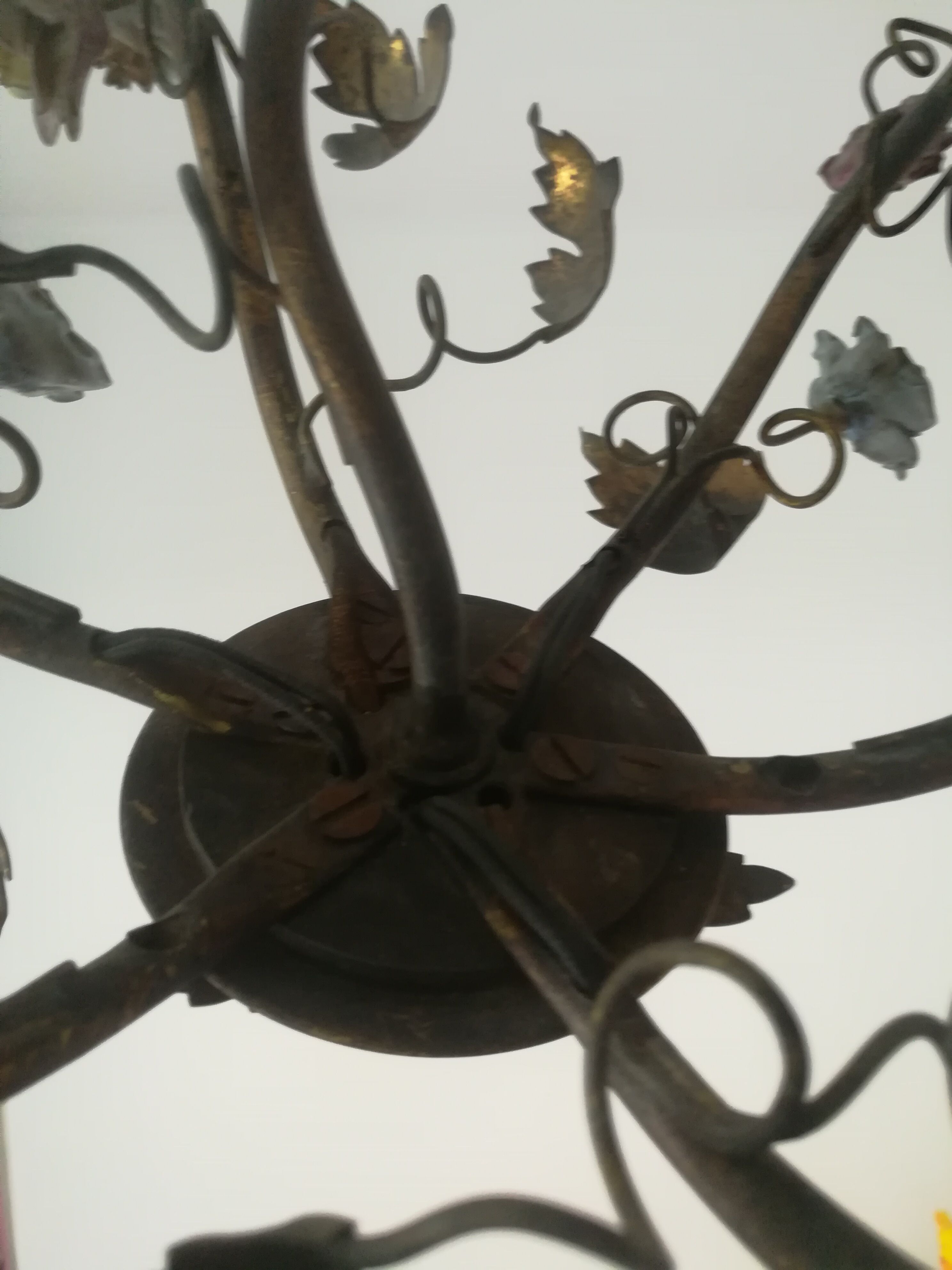 Brass chandelier and porcelain flowers