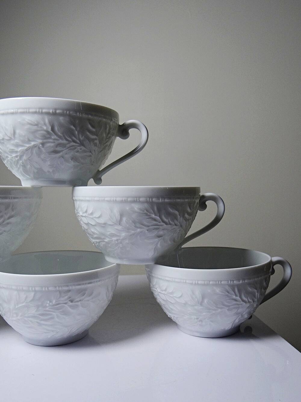 Set of 6 Bernardaud Limoges Louvre model white porcelain cups.