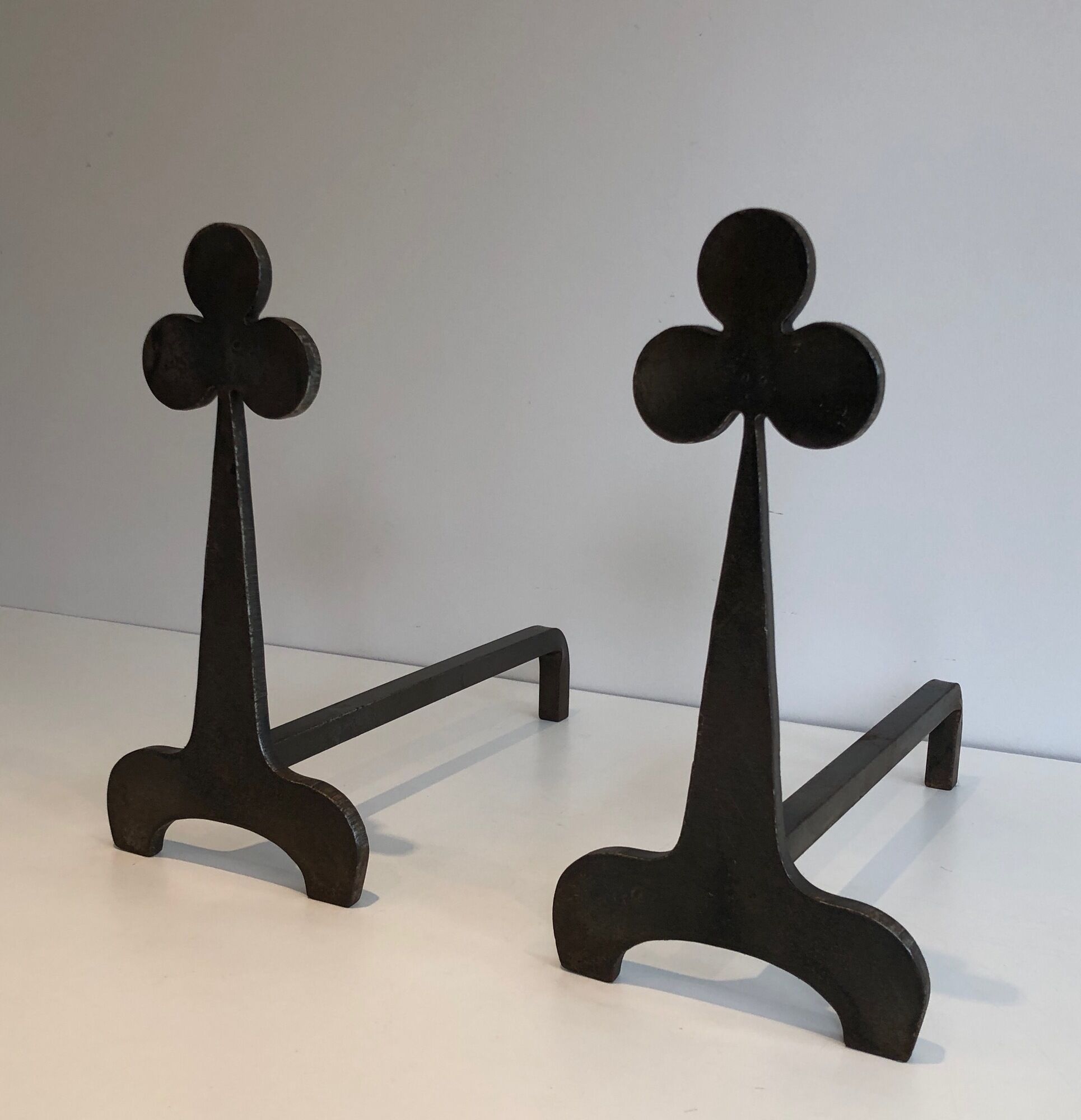 Pair of wrought steel and iron chenets with clover decorations 1950