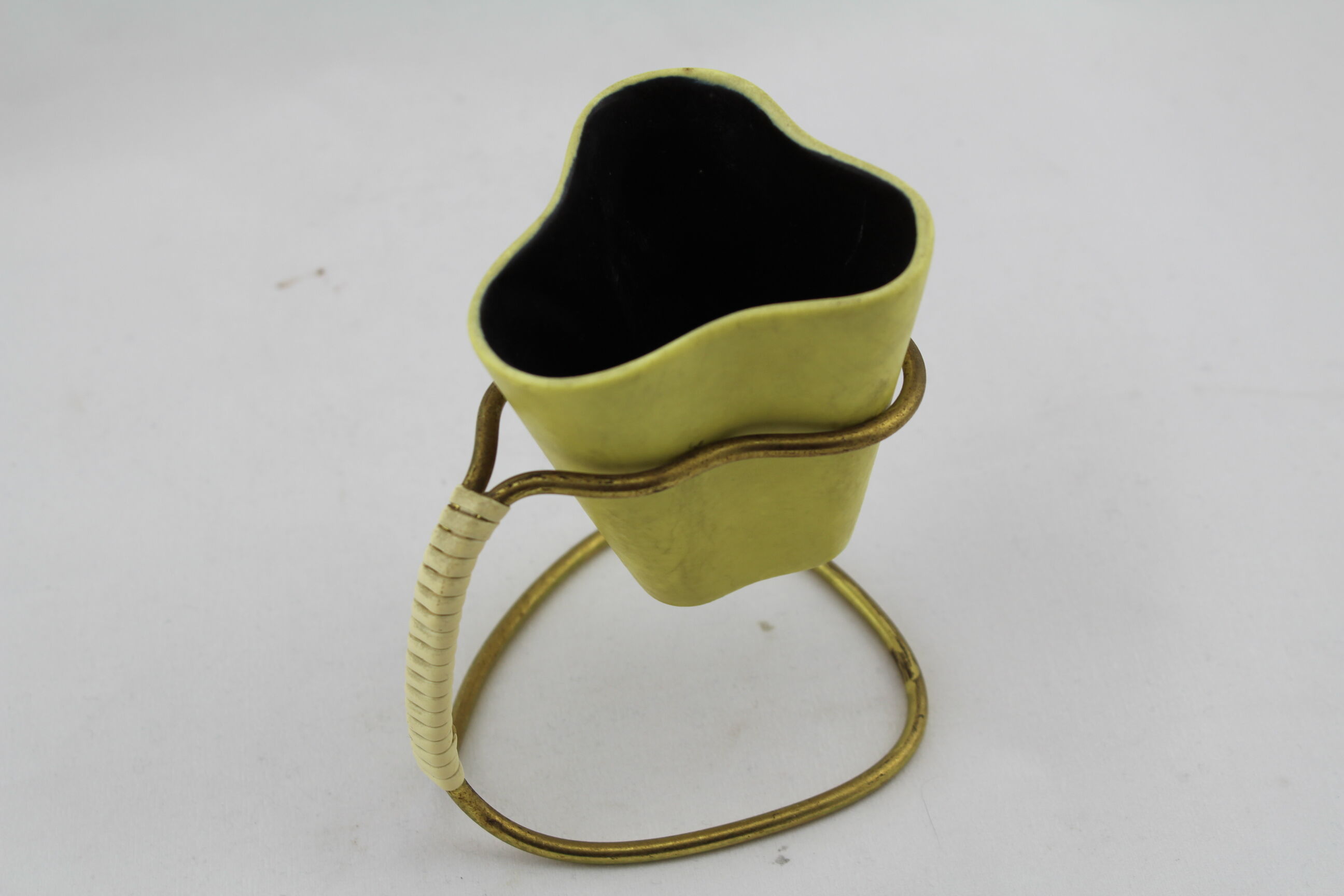 Vase or ceramic pot on foot brass