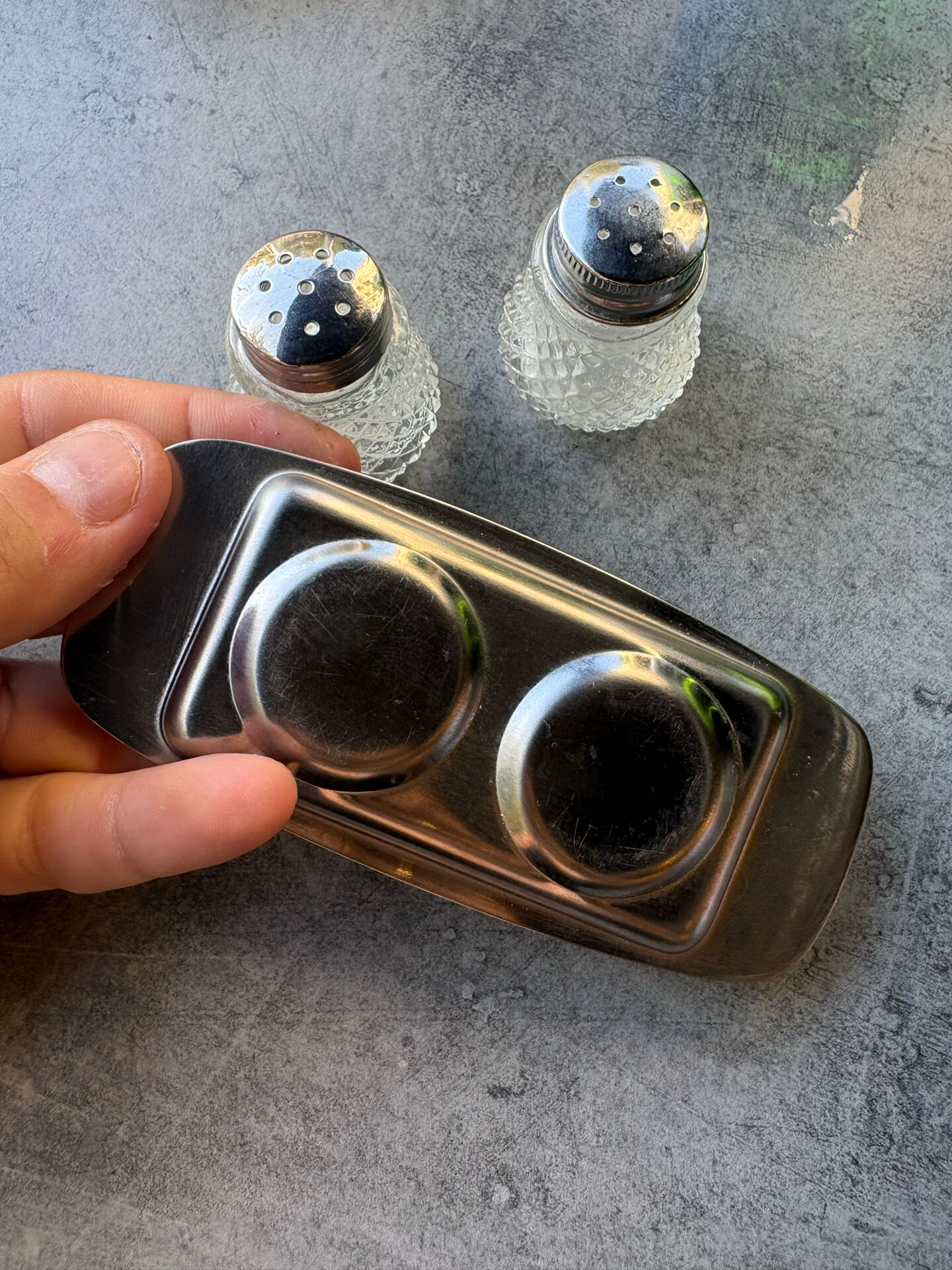 Vintage glass and chrome salt and pepper shaker set.
